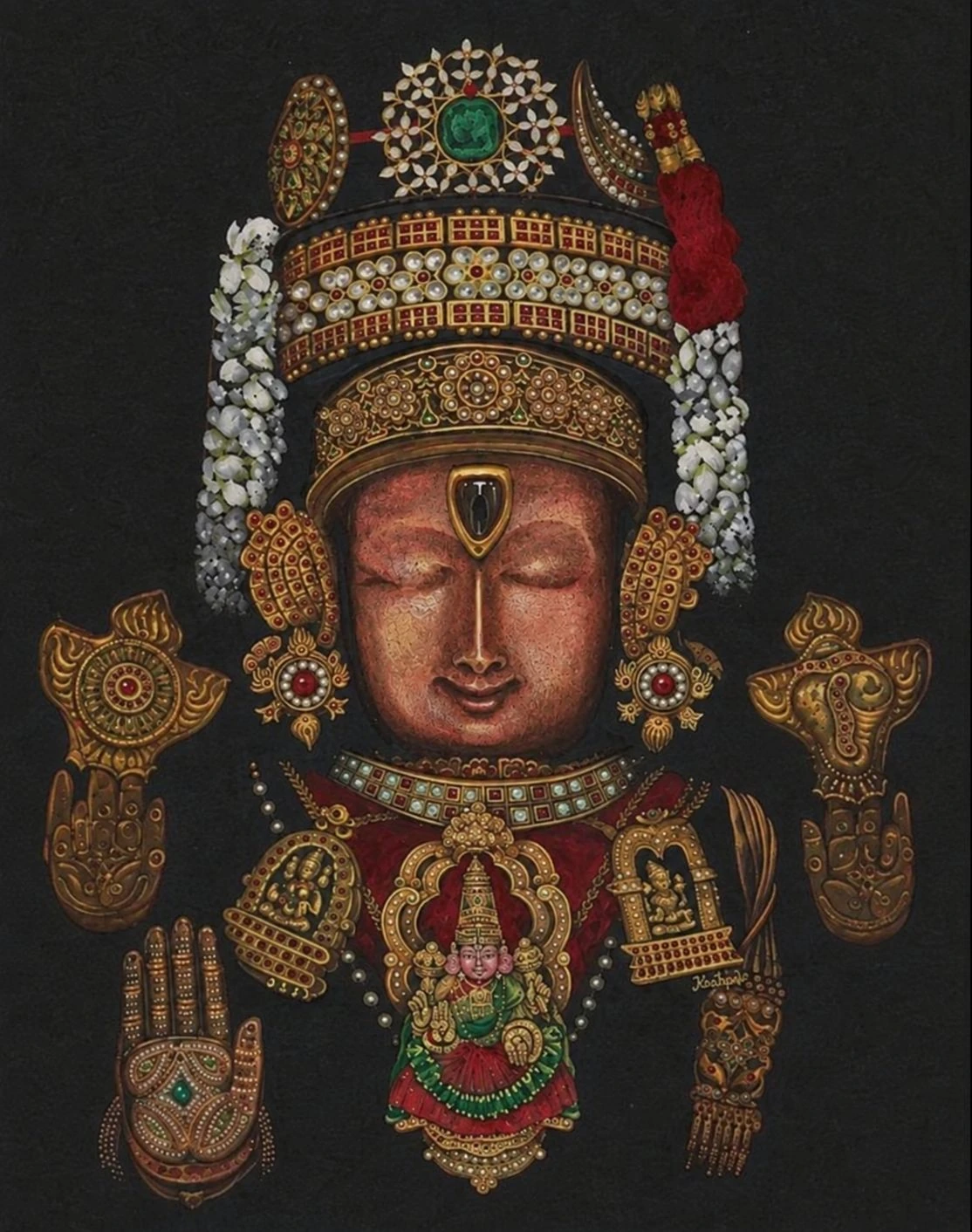 Ornate golden deity adorned with jewels
